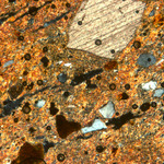 Plate 167.1: Photomicrograph of HUN CG (XPL) (width of field 1.74 mm). Click to see a larger version
